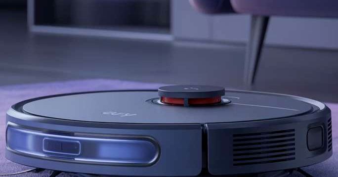 eufy robot vacuum demonstrated on a wooden floor
