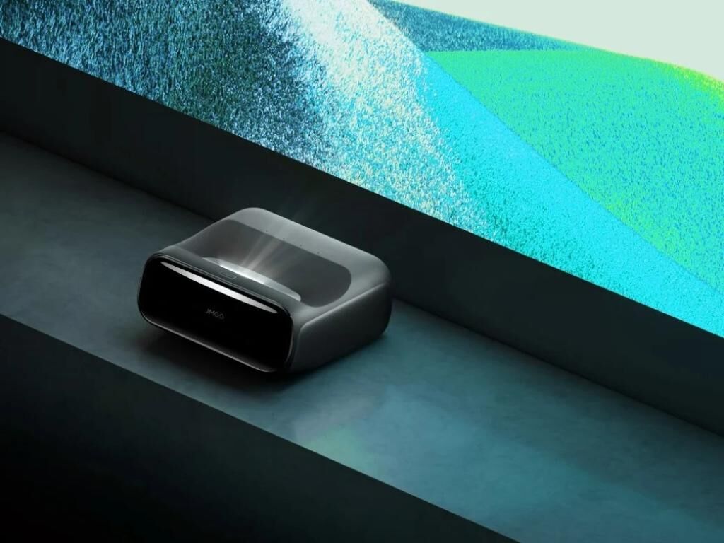 JMGO projector and remote on a table